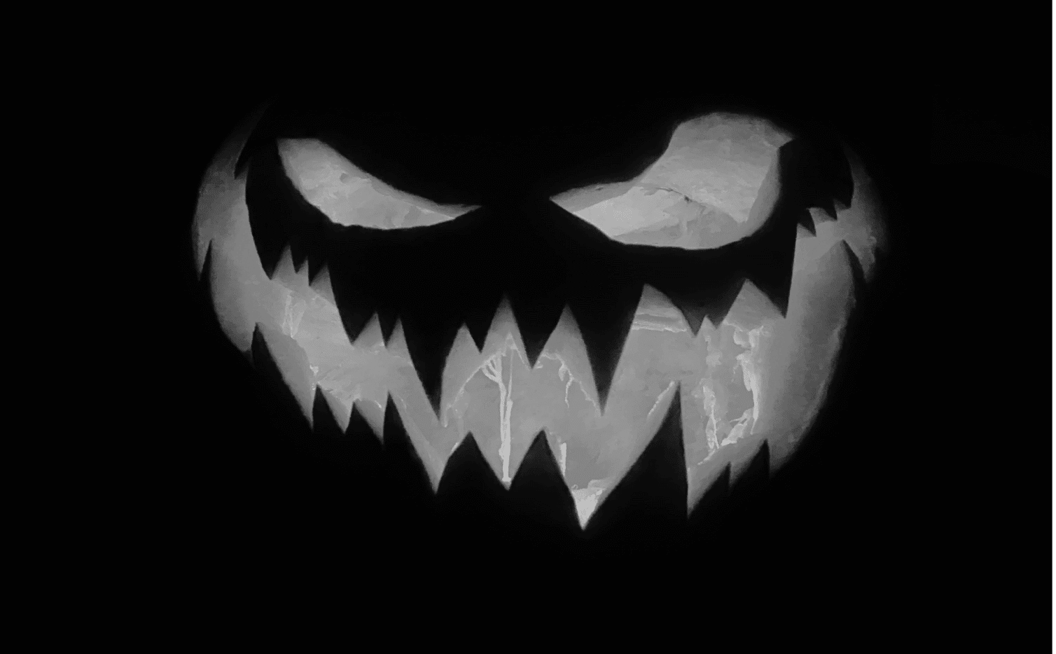 This image of a carved pumpkin illustrates this post's scary story about domains for Halloween.