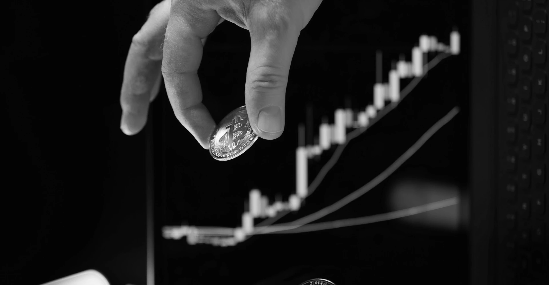 This image of someone picking up a coin from a chart illustrates our discussion topic about tracking the value and return on investment of digital risk protection and cybersecurity.